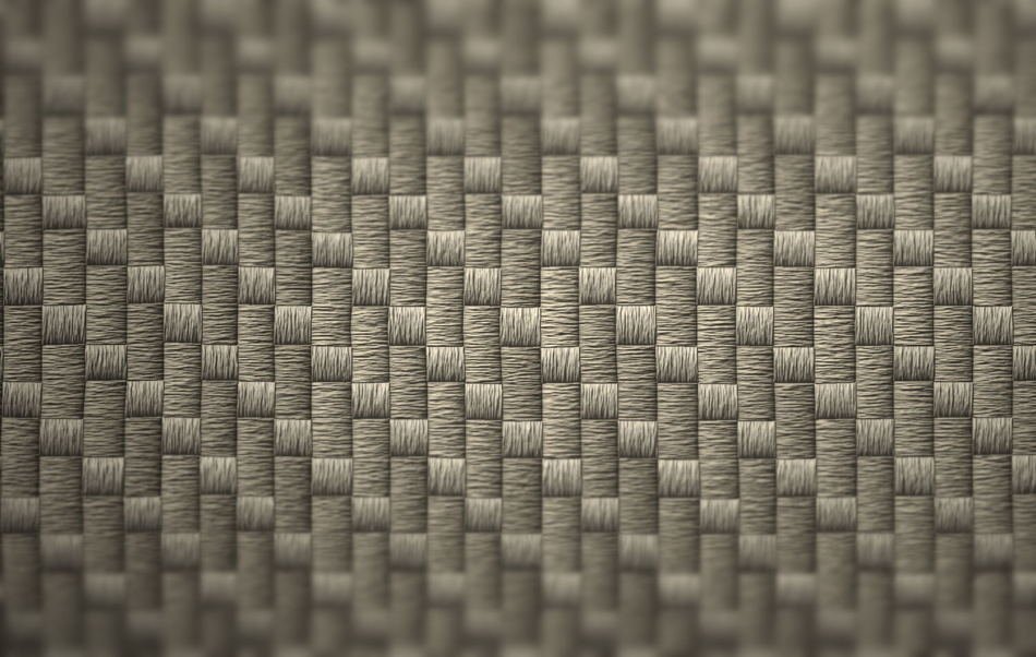 High-magnification view of a woven face, showing individual yarn crossings and surface fibres.