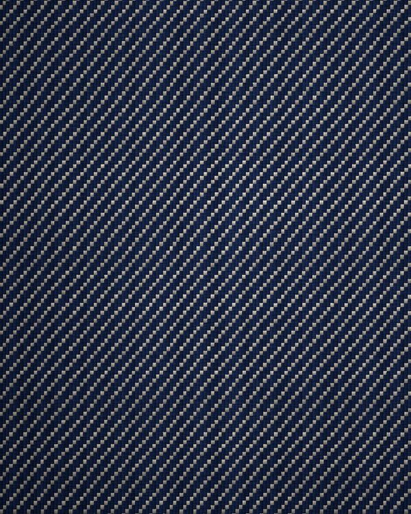 Indigo denim in three-and-one twill, with the undyed weft breaking through the face.